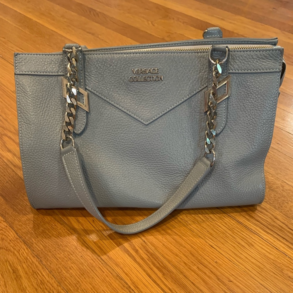 Gray Versace Collection handbag w/ gold hardware.
